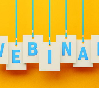 webinar-writes-on-white-price-tag-hanging-from-blue-ribbons-over-yellow-background